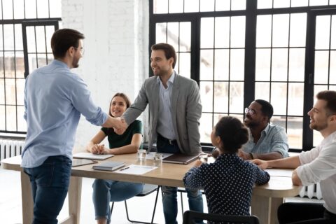 Happy millennial business team welcoming new employee, HR manager getting acquainted with colleague. Group leader shaking partner hand over meeting table, start negotiation, thanking for expert help SSUCv3H4sIAAAAAAAACpxUyW7cMAy9F+g/DHyOAO1Ljv2C3osetHBmhHqsgSWnCIL8e+U1miLooRfDfCQfySdKb1+/nE6dszn67vn0NlvVjn0/5TLaEtNQYfy04SMMAcYWeRmZxC0AIZY0Rtu3oLPFXwd7gwoOU9/P8Pvi7HKxZcqQ5+ob5G2BS+VYwYNibfHHap92x+KsGdXVdU8Nlie3YDu0kv9X5vrzc5/GXmDwrx+9zSnXqRQYc0n+V9tkdRH2QM4P2p2vgmEEe8slLgK1yQ+phNIHW5nPuGxvb6//opGOGsGCQlRrijgWBjnMDApUmaAZIcyFz4hdvCzz3a+ppL8KfId07+GhzLcpxwFy/qBafxY1t5MeoQe7Hv7G1p25UBgwIEwk1O4IRpZIgkAaorghxrlDhU5a7bgmgALDHnHPFLKKUXQ2iouZwFl/BAvFtDHco6ABI65CZQ7BIA2acQdaO0aOYOqCw2diEK+u+gkBWSc8khyIoEBFkMe4nSDUa6k0olS62rP2VVGuEDDPuDlTY5k4gp2UggjPkXdGIU40IC2xQdRxFrTQ+kztotkqfffrd12sW3s/7BRiaq7GS/K2nwNYI+19jD4OlyYtletyd/c0n6ahjPOqHPvR9Sndrasn+Xw6V07Y8avNuYaHHW8K+fpSpFtTZ0hlOdGNtQv1Os8mYVQyrJRhnHJOFd/U3p6Aa6w8Szs70bJtMbSjx7mDzjJsvSAOBUz5tsHBWARO1xrKUaFElfD9DwAAAP//AwAW8Af43QQAAA==